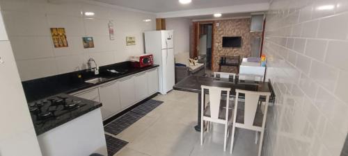 Carianos Apartamento | Moradas Desterro, próximo ao aeroporto 01