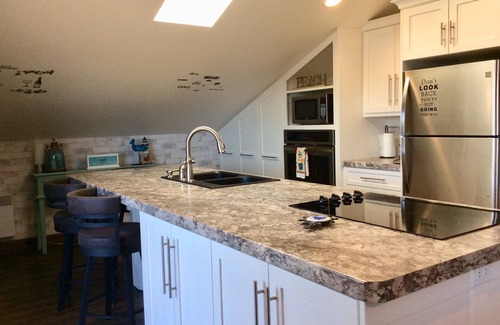 Cardigan Casa | NUEVO, suite junto al mar en un hermoso entorno cerca de varios servicios.