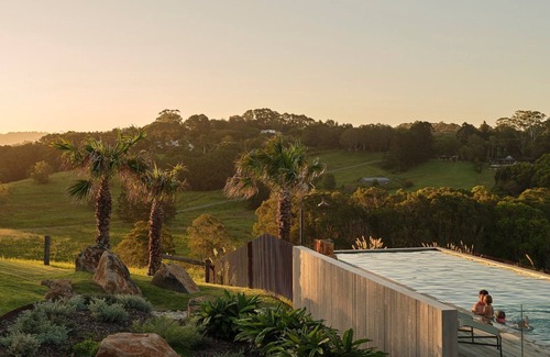 Myocum Casa | Myocum Ridge Farm - A winding driveway, cows, blue skies, manicured lawns, glittering pool