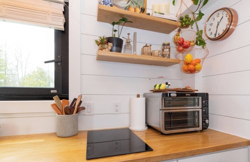 Alexander Casa | Nestled in the mountains, this cozy tiny home is 15 minutes to Asheville.