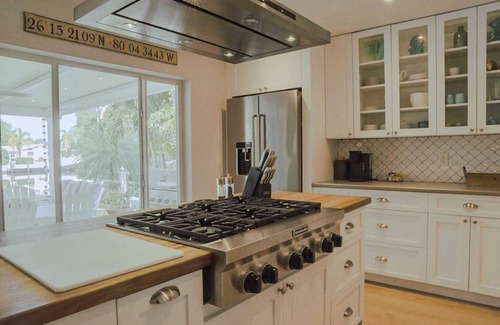 Cypress Lakes Casa | New! Amazing Waterfront Island Breezes - Heated Pool, Dock!