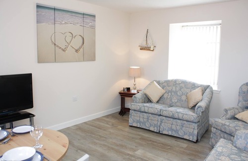 Banff Apartamento | Nuevo apartamento con vistas al mar, la playa y el puerto de Banff