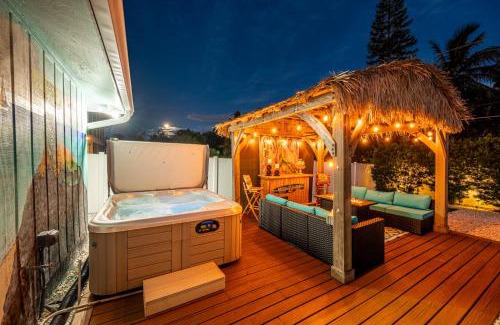 Whitney Beach Casa | NEW! Blue Iguana! Tropical backyard oasis with heated pool, hot tub, fire table, and more!