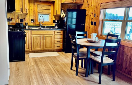 Spooner Cabaña | NEW Cottages on the Lake Near Spooner WI. Steps from sand shore of McKenzie Lake