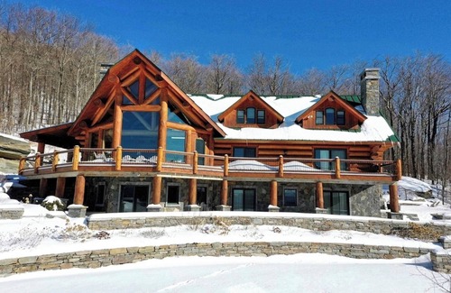 Andover Casa | New listing! Stunning Log Cabin on 70 acres w/private pond & hot tub, near Okemo