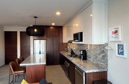 Libertad Condominio | New! Slick designer apARTtment with bay views.