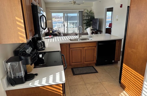 Gypsum Condominio | NEW spacious 2 BR / 2 BA w. pool, dockage available, bar