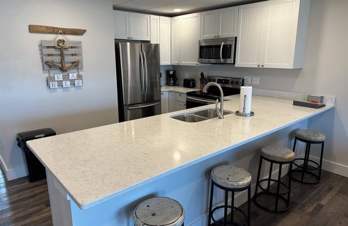 Gypsum Condominio | NEW spacious 2 BR / 2 BA w. pool, dockage available, bar