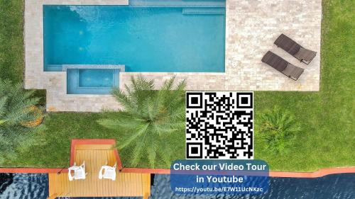 North Corals Casa | New! Waterfront Heated Pool & Jacuzzi 2 mi to Beach - Fishing Pier Relaxing SPA & Hammock