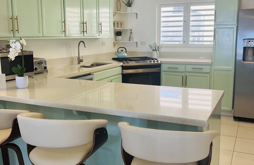 West End Village Casa | Newly Renovated Luxury West End Home Steps to Mead’s Bay and the Four Seasons.