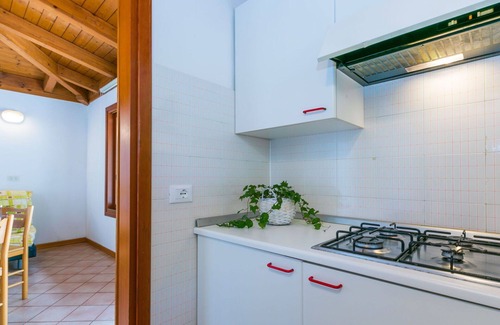 Grado Casa | Bonito apartamento en villa con WIFI, piscina, terraza, mascotas permitida y aparcamiento