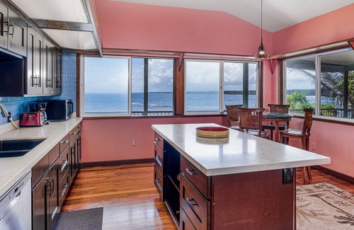 Keaau Casa | Oceanfront home with private hot tub, wraparound deck, ocean views, W/D & lanai