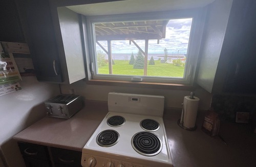 Cormierville Casa | Oceanfront paradise, 4-bedroom house in Cocagne with hot tub, WiFi, AC.