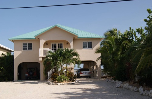 Breezeswept Beach Estates Casa | Alquiler frente al mar con piscina climatizada, Muelle & Tiki Hut