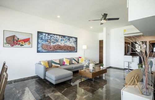 Ixil Apartamento | Oceanfront retreat with private balcony, outdoor pool, and stunning views