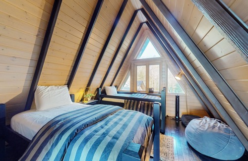Eagle River Casa | One-of-a-kind lakefront A-frame overlooking Echo Lake with theater room