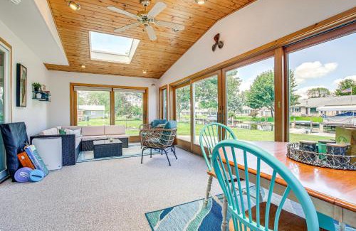 Oshkosh Casa | Oshkosh Canal-Front Home with Sunroom and Watercraft!