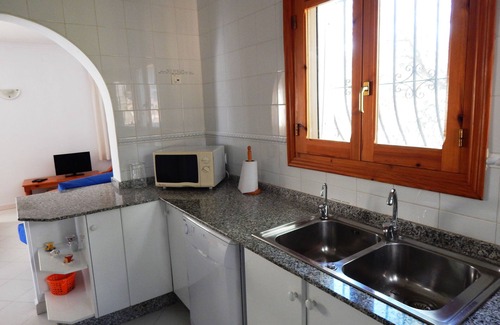Orba Villa | Villa Paloma, con piscina privada, terraza y porche con vistas al mar.