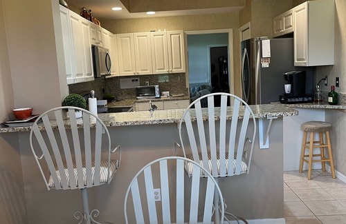 Naples Casa | Paradise Awaits! Country Club Living, Private Golf Course, beaches, 1st Floor!