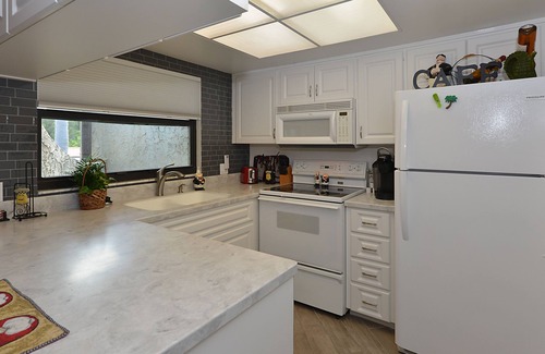 Palm Harbor Condominio | Frente de agua 'Paradise' Lake Tarpon Condominio con 19 'Barco