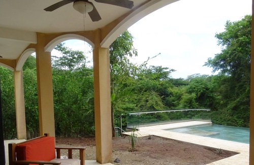 Tamarindo Apartamento | Peaceful, entire first floor apartment with pool surrounded by wildlife