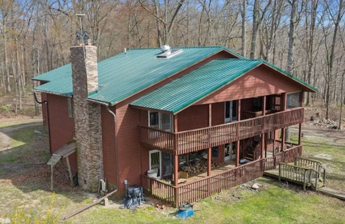 Delton Casa | Peaceful Lake House with pontoon boat rental on property.