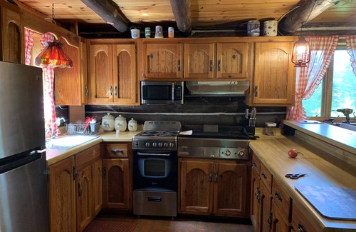 Spooner Cabina | Peaceful retreat on Yellow River. Kayak, canoe or explore our 20 wooded acres!
