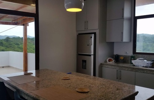 Comuna San José Condominio | Vista del ático desde la colina en Las Núñez
