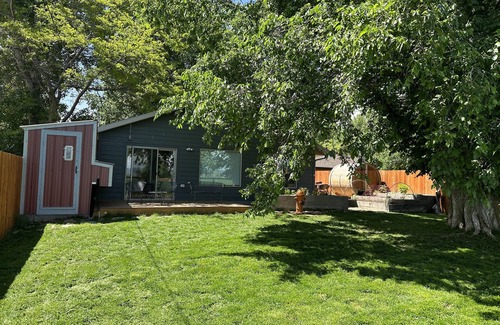 Ennis Casa | Pet friendly home with fenced yard, gardens and sauna one block from Main Street