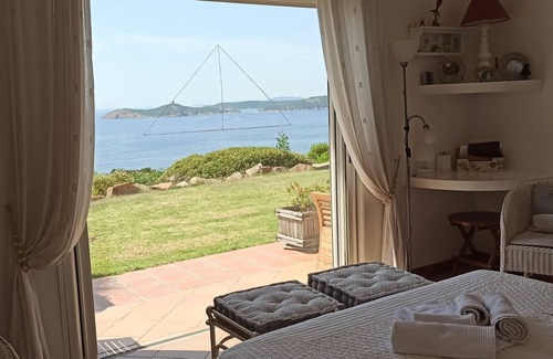 Pinarellu Villa | VILLA de 300 m2 de alto standing en terreno de 2700 m2.7 dormitorios, 6 baños, PISCINA CLIMATIZADA con vista a Bavella, SPA con vista a la Bahía de Pinarello, playa de arena 5 '