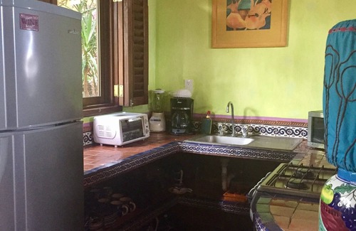 Los Ayala Apartamento | Playa Suite: Suite frente a la playa con patio privado en medio de jardines tropicales