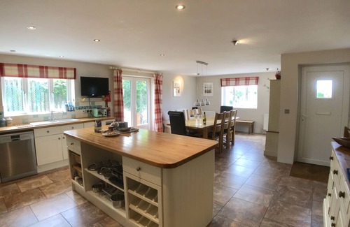 Trevone Casa | Polcarrek contemporary holiday home with parking and garden. Balcony with rural views