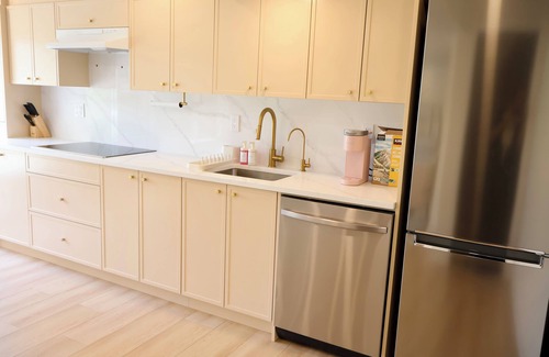 Valley Ridge Casa | Pond View 2 Bedroom Walkout Basement Suite on Golf Course with Fireplace & Sauna