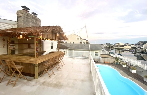 Osborn Island Casa | POOL, TIKI BAR, WATERFRONT home, 8 LBI Beach passes in Mystic Island NJ