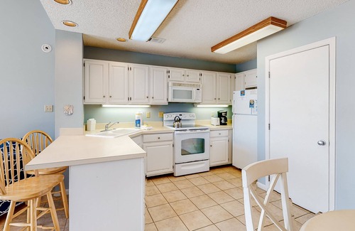 East End Casa | Poolside dog-friendly townhouse with partial Gulf views, on-site pool & grills