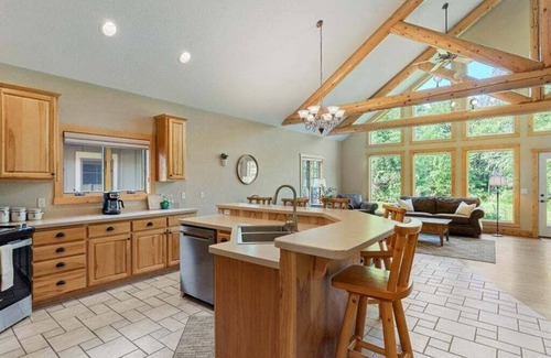 Nisswa Casa | Popular Interlachen Condo with Relaxing Creek Views & steps away from Gull Lake