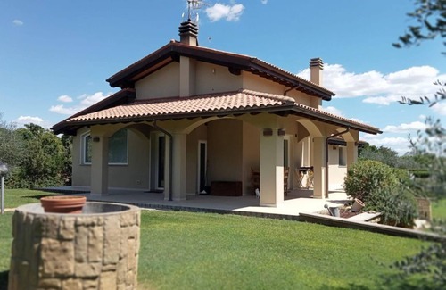Castiglione della Pescaia Villa | Portion of villa with large garden and beautiful barbecue area 5 minutes from the sea