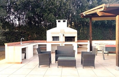 Castiglione della Pescaia Villa | Portion of villa with large garden and beautiful barbecue area 5 minutes from the sea