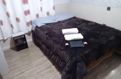 Lages Casa | POUSADA ALTERNATIVA MANU LAGES Quarto Com Banheiro no Corredor