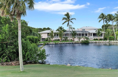 Key Largo Casa | Private 5 BR Ocean Reef Estate overlooking pond and The Hammock Golf Course.