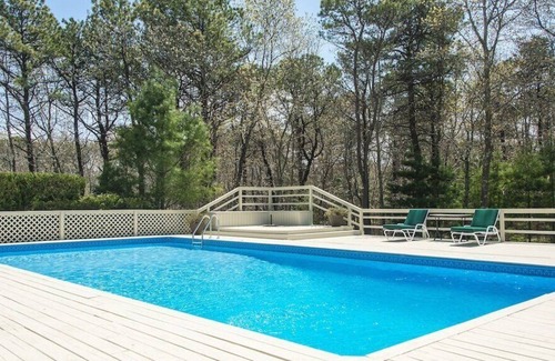 Wainscott Woods Casa | Private Hamptons vacation home, set on an acre of land, entertainer’s...