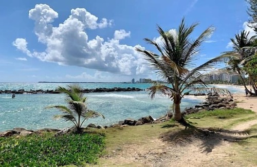 Punta Las Marias Apartamento | Puerto Rico Beach Rental w Pool Balcony Otium Rentals