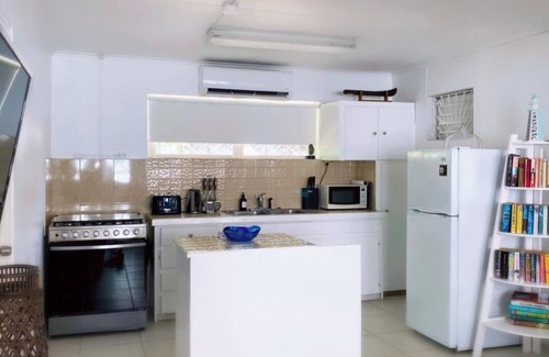 Gibbs Bay Villa | Purple Rain: Beach House, Sun Terraces, Full Kitchen, WiFi under azure skies