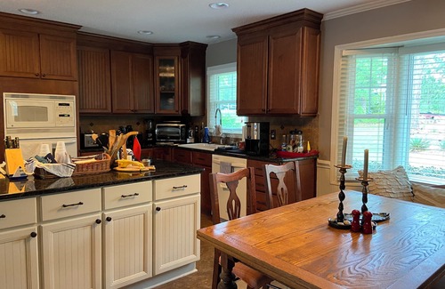Olivia Casa | Put your feet up, relax and unwind on the screened porch or go jump in the lake!