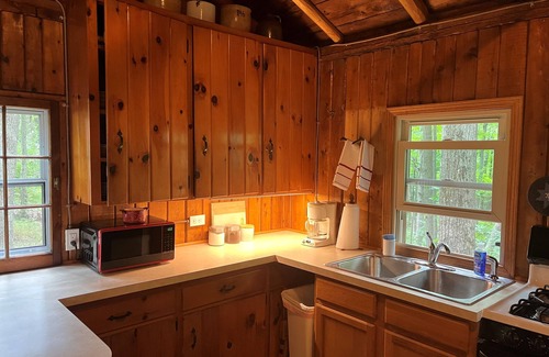 Harrison Cabina | Quaint and cozy log and knotty pine cabin close to lakes.