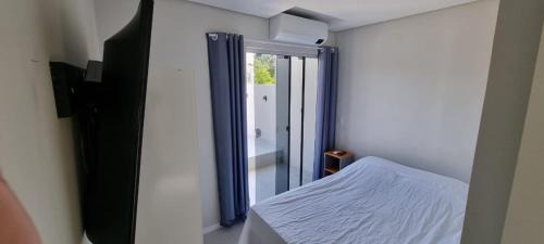 Ribeirao da Ilha Apartamento | Quartos Confortáveis em casa compartilhada - 5 min Aeroporto Internacional