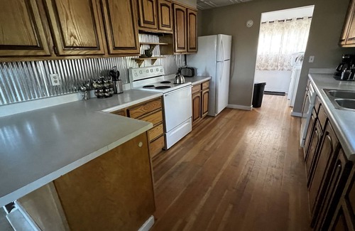 Lander Casa | Quiet neighborhood, relaxing wrap around deck with fire pit. Short walk to town.