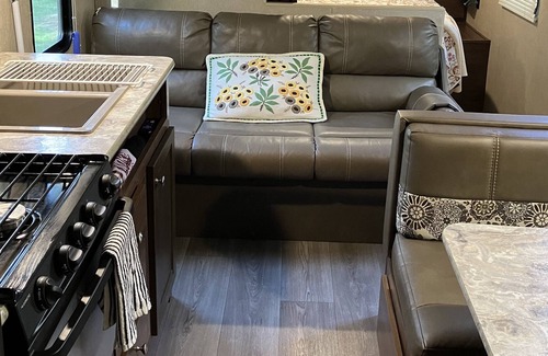 Brevard Casa | Rader Retreat RV/Camper cozy spot to sit out on the deck after a day of hiking.