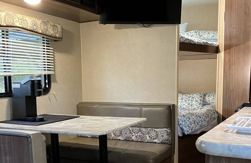 Brevard Casa | Rader Retreat RV/Camper cozy spot to sit out on the deck after a day of hiking.