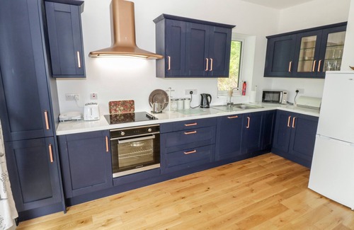 Clifden Cabaña | RAINBOWS END, pet friendly, with open fire in Clifden, County Galway